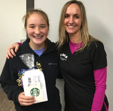 Dr. Backus and one of her happy patients with braces that won hygiene rewards, Backus Smiles