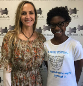 Backus Smiles, Dr. Backus with a happy new patient with braces, Share-A-Smile program