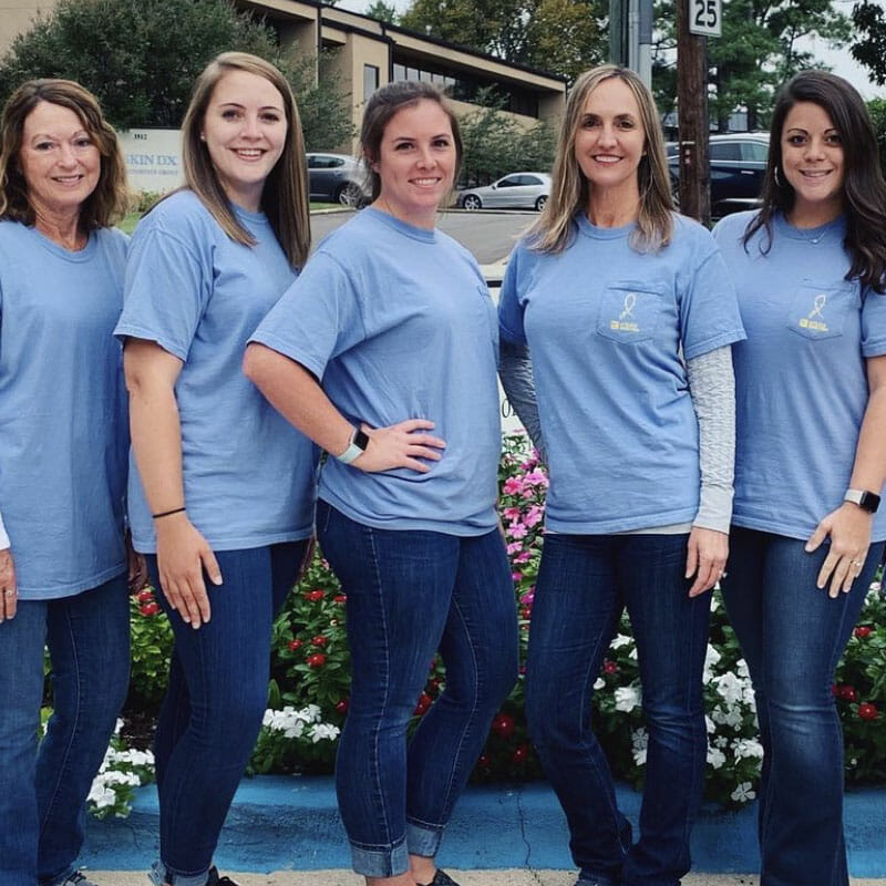 Backus Smiles, Dr. Backus and her team after doing charity work