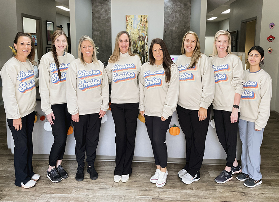 Dr. Backus and her team in matching Backus Smiles sweatshirts, Backus Smiles